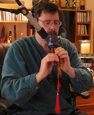 Clint playing the Hulusi